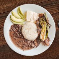 Churrasco Chapín · Chapin Barbecued Steak. Served with rice, beans, cheese, sour cream, chives, and red sauce.