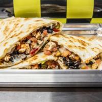 Quesadilla · Grilled flour tortilla with meat, shredded cheese, and grilled vegetables.
