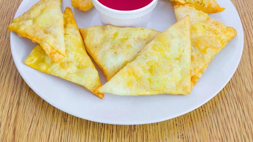 Crab Rangoon (Cheese Wonton) · Cream Cheese filling, no meat.   Served with sweet and sour dipping sauce.