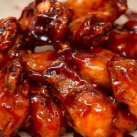 Crispy Bbq Chicken Wings · Super Crispy Chicken Wings Tossed in Our House BBQ Sauce.