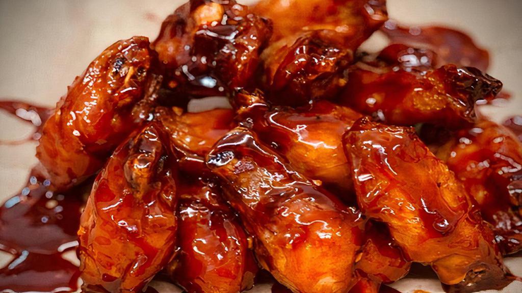 Crispy Bbq Chicken Wings · Super Crispy Chicken Wings Tossed in Our House BBQ Sauce.