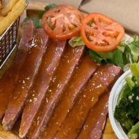 Homestyle Corned Beef Platter · Cooked in a sweet pepper gravy.  Served with a choice of 2 sides.