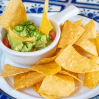 Guacamole · Corn tortilla chips, ripe avocado, lime juice, tomato, onion, cilantro and jalapeño (choice ...