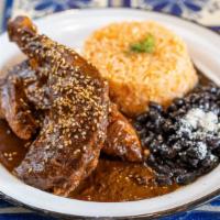 Mole Poblano · Concoction of chocolate, dried chiles, raisins, mixed knots, plantains sesame seeds, spices ...