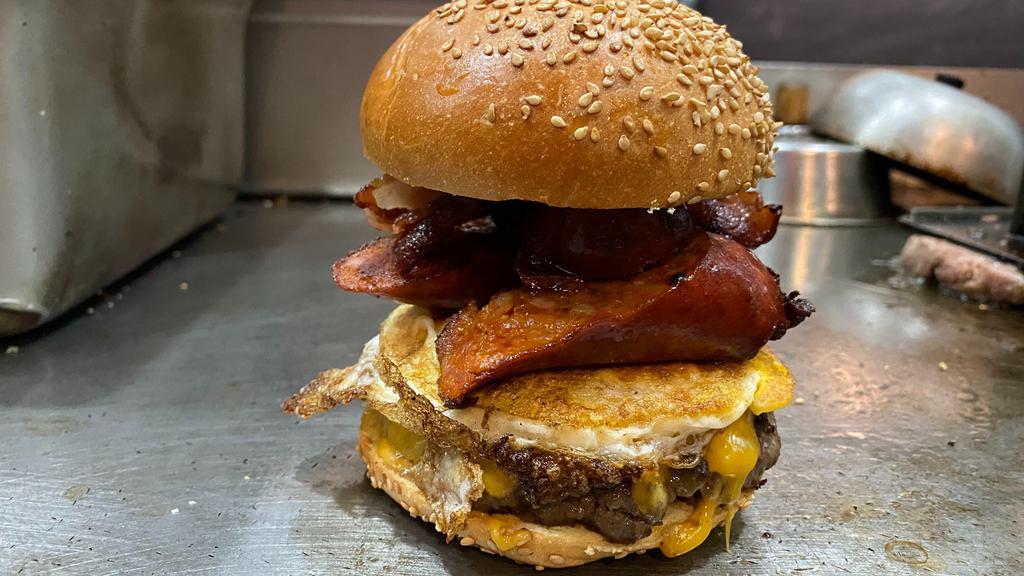 Heart Attack Burger · cheddar cheese ,one fried egg chorizo bacon n fried onions