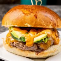 Mexican Burger · Handmade beef burger avocado, Cheddar, jalapeños and chipotle. sauce