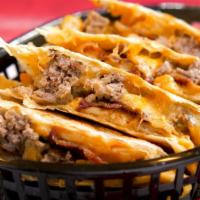 Burgrito Quesadilla · A burgrito in quesadilla form! Burger, French fries, Bacon, melted cheese, chipotle sauce in...