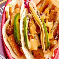 Fish Taco · Fried fish, shredDed cabbage, pico De gallo, sliced avocado, chipotle sauce wrapped in a sof...