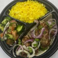 Lamb Lule · Comes with rice and fresh salad.