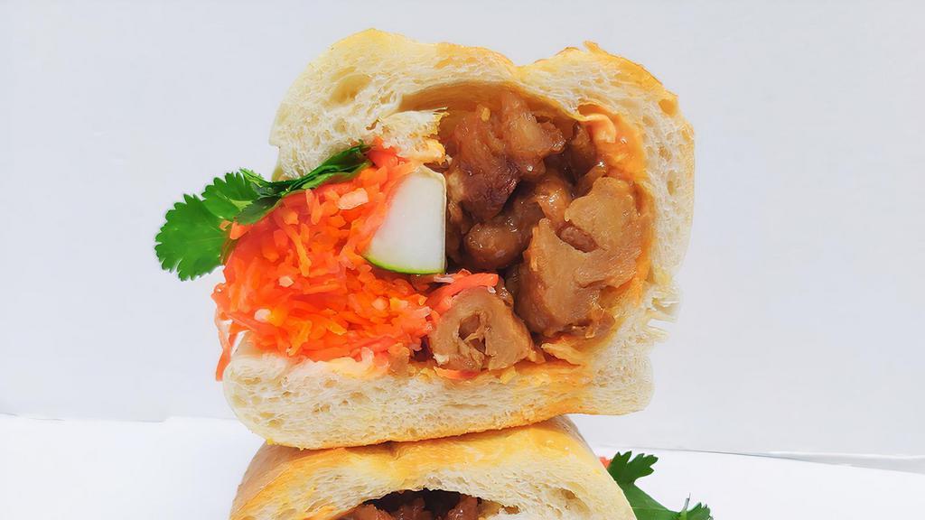 Ginger Seitan Bites Banh Mi · Please notify a staff if you have dietary restrictions or allergies..
Seitan (made from Soy and Tofu) bites sautéed in ginger and aromatics.
Sandwiche come with toasted baguette, mayonnaise, cucumber, pickled daikon & carrots, cilantro