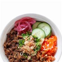 #4B Beef Bulgogi Bowl · Korean-style, thin cut marinated ribeye beef. - bowls come with pork house sauce, kimchi, pi...
