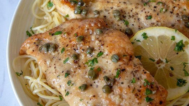 Chicken Picatta · Pan seared chicken, capers, artichokes, lemon white wine sauce over creamed spinach or kale and mashed potatoes.