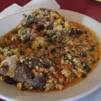 Egussi · Spinach casserrole with ground melon seed and assorted meat. Served with your choice of Poun...
