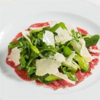 Carpaccio Di Manzo* · thinly sliced raw filet mignon, wild arugula, 24-month aged Parmigiano-Reggiano, black truff...