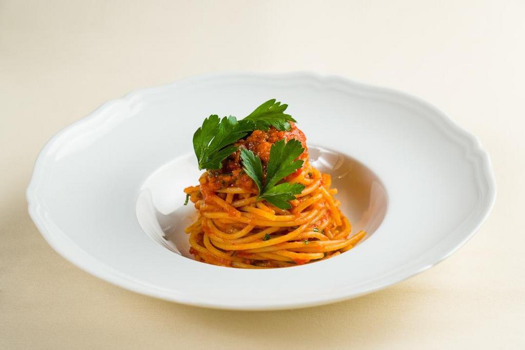 Spaghetti All'Arrabbiata · spicy San Marzano tomato sauce, Italian red peperoncino, garlic confit, fresh parsley