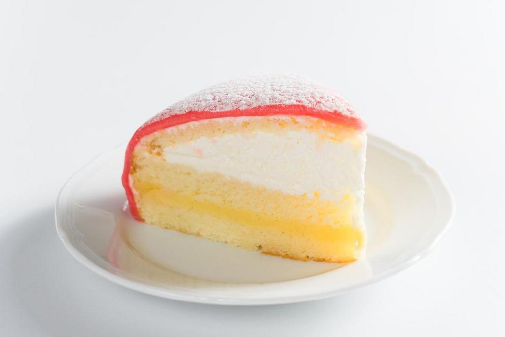Principessa · lemon sponge layered between vanilla pastry cream and whipped cream, topped with almond marzipan