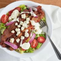Blt Salad · Crispy romaine, bacon, crumbled bleu cheese, tomatoes, red onions, bleu cheese dressing.