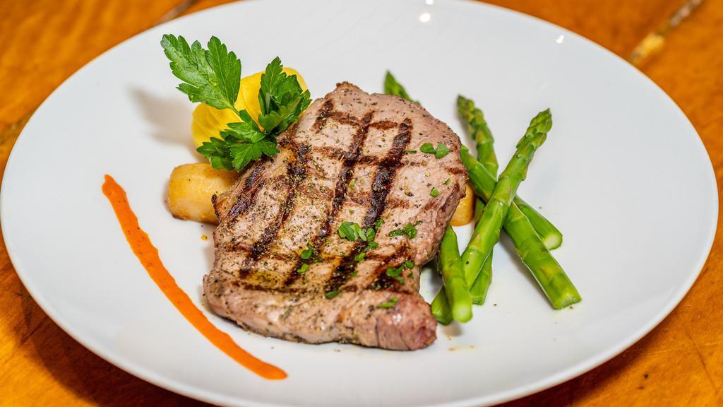 Rib Eye Steak · Gluten free. 14 oz simply grilled, oregano, lemon, olive oil, lemon potatoes, baby kale.