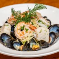 Seafood Thalassina · Gulf shrimp, mussels, scallops, steamed in white wine, orzo pasta.