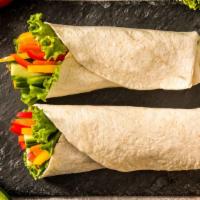 Mixed Veggie Burrito · Soft, flour tortilla stuffed with grilled peppers, onions and mushrooms, homemade rice and b...