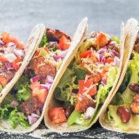 Veggie Tacos · Three street-style, soft shell tacos with sautéed peppers, onions, peppers and mushrooms, fr...