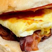 Breakfast Sandwich · 2 Eggs, Cheese and choice of Meat on a Kaiser roll.