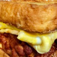 Sweet Guy Sandwich · Eggs, Cheese and choice of Meat on a French Toast.