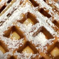 Waffle Side · Belgian Waffle with powder sugar, butter and syrup on the side.