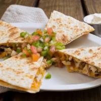 Quesadilla · Cheddar, Monterey Jack cheese, pico de gallo, and homemade chipotle sauce on a white tortill...