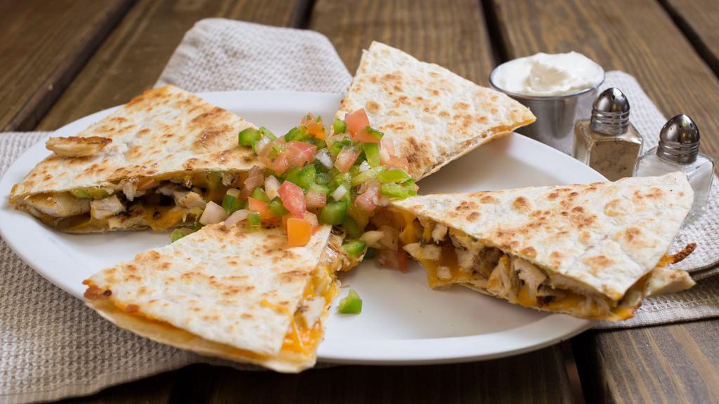 Quesadilla · Cheddar, Monterey Jack cheese, pico de gallo, and homemade chipotle sauce on a white tortilla, served with sour cream and salsa on the side.