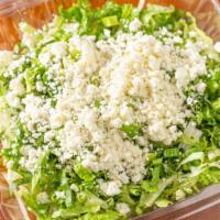 Prasini Salad · Pra-si-ni. Romaine lettuce, dill, scallions, feta cheese, with an extra virgin olive oil and...