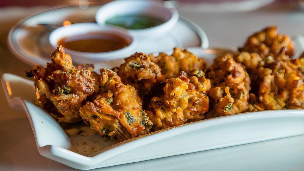 Street Style Veg Pakkora · Fresh veggies in masala golden fried in a seasoned chickpea batter.