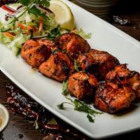 Grilled Chicken Tikka · Marinated chicken pieces skewered together and smoked in tandoor.