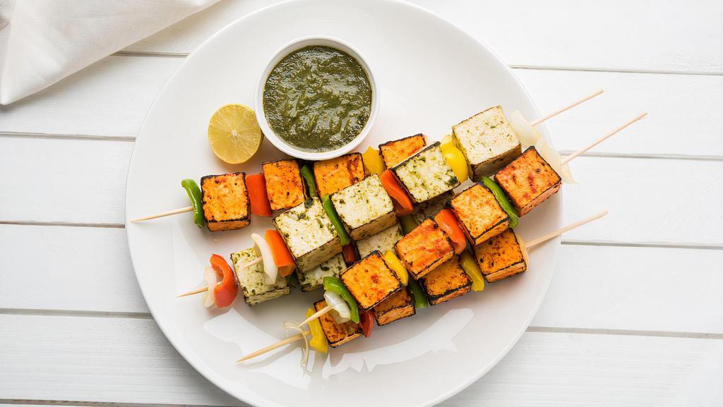 Grilled Paneer Tikka · Crispy chunks of paneer marinated in spices and grilled in a tandoor.