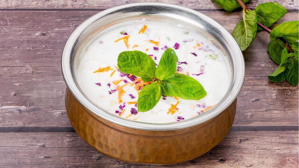 Raita · Refreshing yogurt with diced cucumber, and seasonings (Based on physical store - Mint Raita etc.)