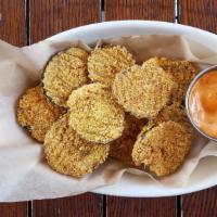 Fried Pickles · Krinkle cut hot and spicy, cornmeal crusted, and chipotle aioli.