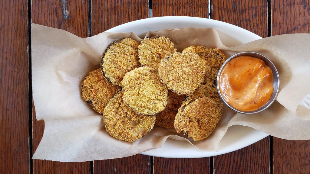 Fried Pickles · Krinkle cut hot and spicy, cornmeal crusted, and chipotle aioli.
