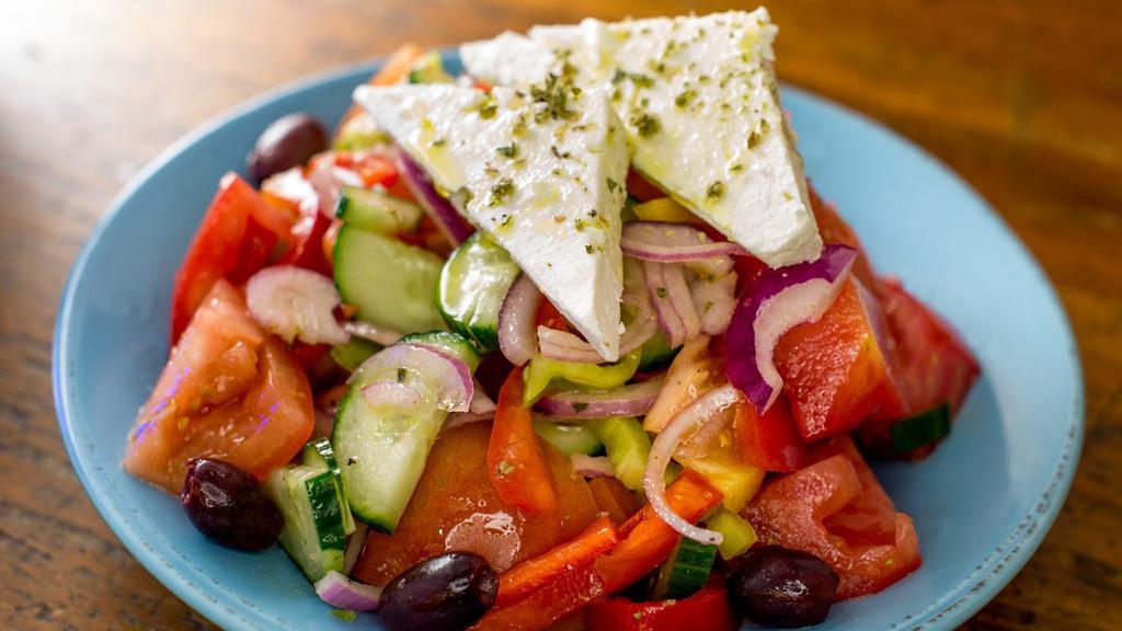 Horiatiki · Greek salad with tomatoes,cucumbers, peppers, red onion, olives, feta, red vine and olive oil dressing