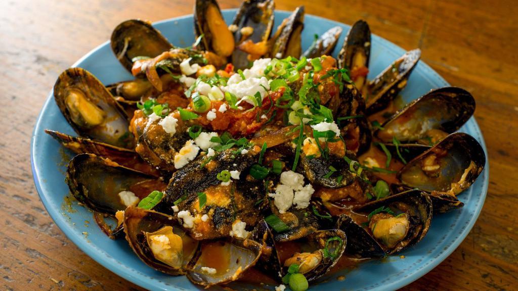 Mussels Ahnista · Sauté in tomato sauce with herbs and ouzo sprinkle with feta.