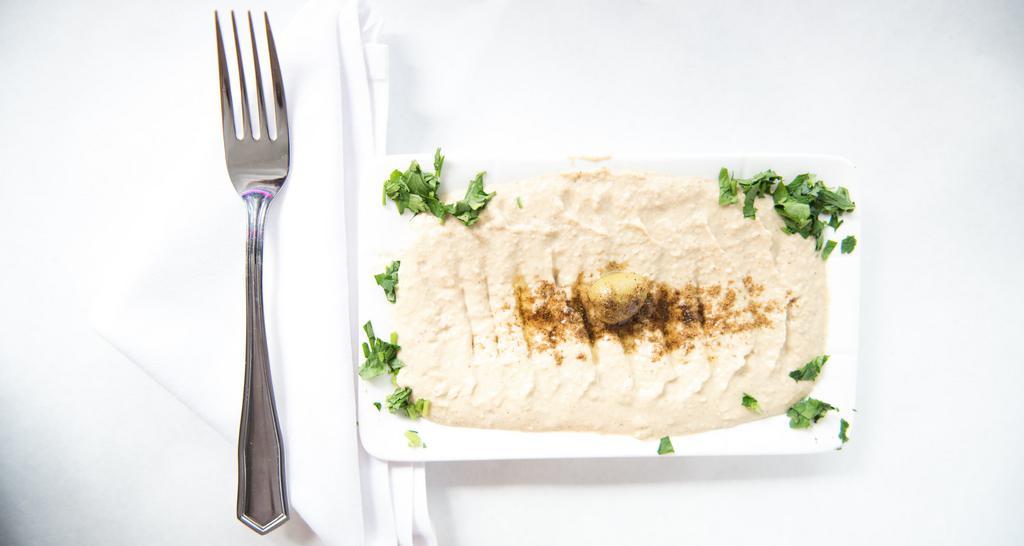 Hummus · Mashed chick peas with a touch of sesame butter.