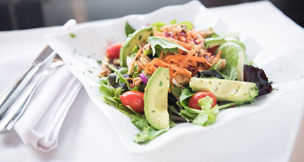 Avocado Salad · Mixed greens, tomato, scallions, avocado, and walnuts served with homemade herb dressing.