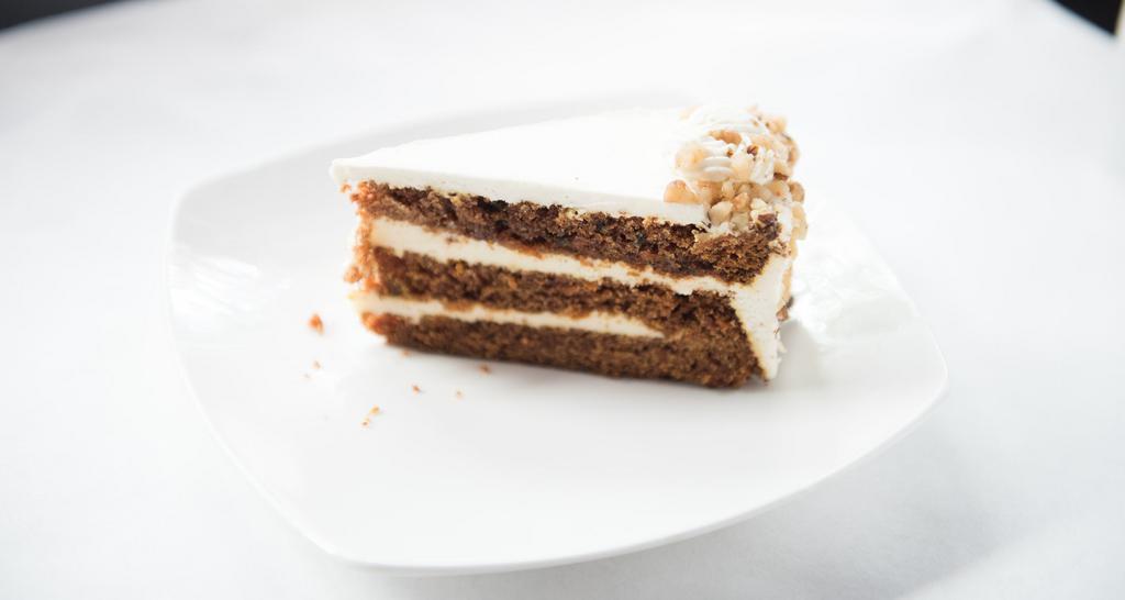Carrot Cake · Moist carrot cake blended with walnuts and lemon cream cheese.