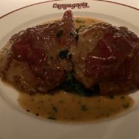 Saltimbocca · Topped with prosciutto on spinach with white wine and lemon