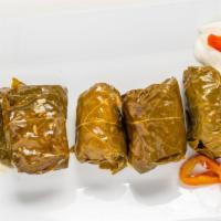Dolmades · Stuffed grape leaves with rice & herbs.
