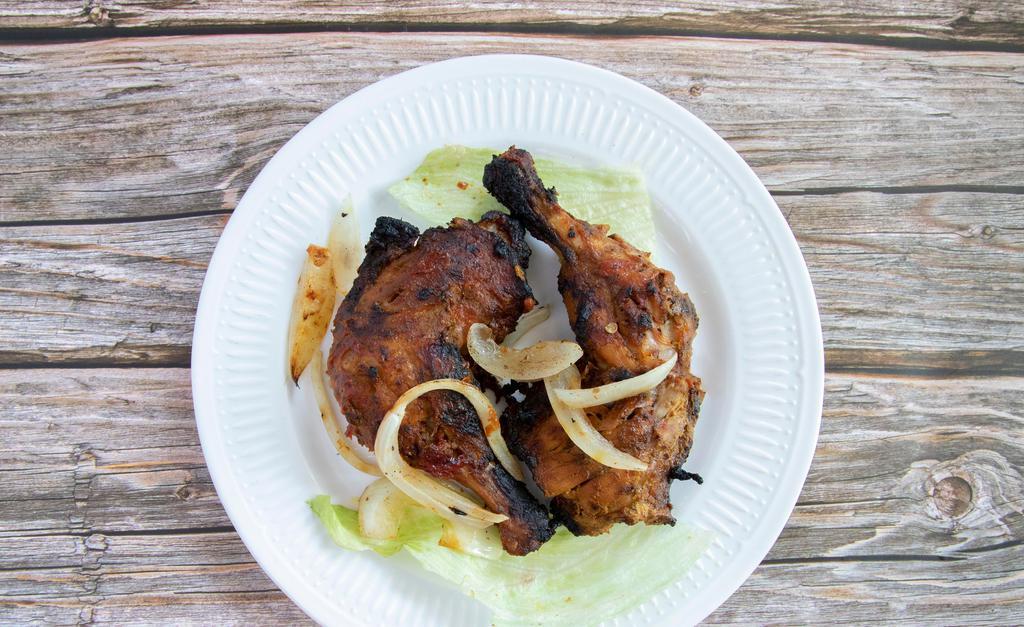 Tandoori Chicken · Bone-in chicken baked in a clay oven, marinated with yogurt and spices. Does not include rice.