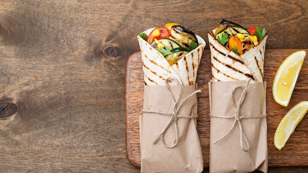 House Vegetarian Wrap Sandwich · Delicious Wrap made with Grilled zucchini, squash, mixed bell peppers, olive with hummus, and olive oil.