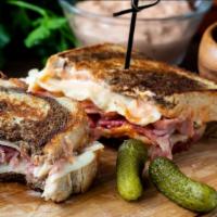 The Combo Panini · Grilled Panini Sandwich made with Pastrami, corned beef, provolone cheese, lettuce, tomato, ...