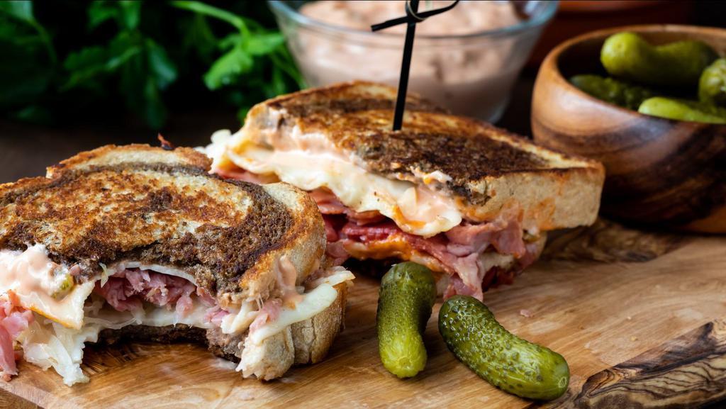 The Combo Panini · Grilled Panini Sandwich made with Pastrami, corned beef, provolone cheese, lettuce, tomato, mustard, and house dressing.