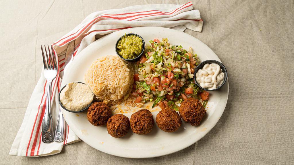 Falafel · 5 lightly fried falafels mixed with chickpea, cilantro, onion, black pepper, salt, vegetable powder, falafel spice. Served with tahini, hot sauce, and hummus on the side.