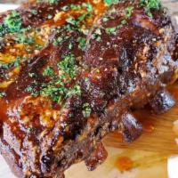 Butcher Bill'S Rib Tips · 4 hr Braised Berkshire pork shoulder ribs, BBQ glaze, and pepperoncini.